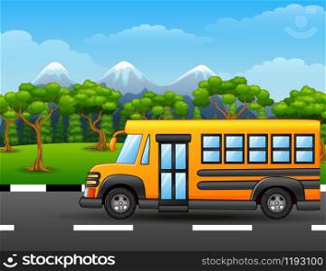 Yellow school bus on road with mountains and trees