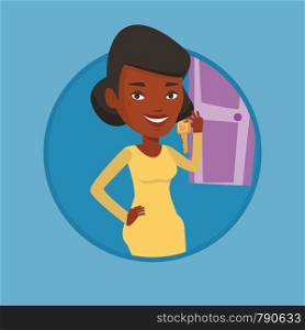 Young african-american business woman showing key on the background of door. Concept of making the right decision in business. Vector flat design illustration in the circle isolated on background.. Making the right decisions in business.