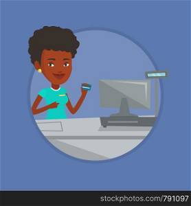 Young african-american cashier holding credit card at the checkout in supermarket. Cashier working at checkout in a supermarket. Vector flat design illustration in the circle isolated on background.. Cashier holding credit card at the checkout.