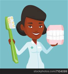 Young african-american female dentist holding dental jaw model and a toothbrush in hands. Friendly dentist showing dental jaw model and toothbrush. Vector flat design illustration. Square layout.. Dentist with dental jaw model and toothbrush.