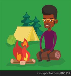 Young african-american man sitting near campfire at a campsite. Travelling man sitting on a log near a campfire. Smiling tourist relaxing near campfire. Vector flat design illustration. Square layout.. Man sitting on log near campfire in the camping.