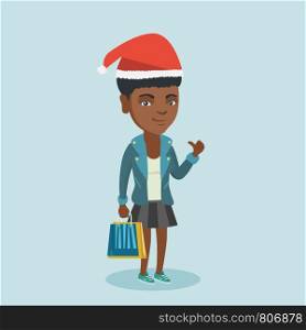 Young african-american woman in santa hat holding shopping bags with christmas gifts and giving thumb up. Cheerful woman shopping for christmas gifts. Vector cartoon illustration. Square layout.. Woman in santa hat shopping for christmas gifts.