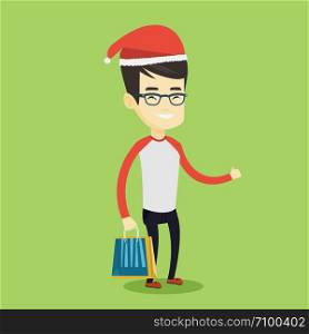 Young asian man carrying shopping bags with christmas gifts and giving thumb up. Man in santa hat holding shopping bags. Man buying christmas gifts. Vector flat design illustration. Square layout.. Man in santa hat shopping for christmas gifts.
