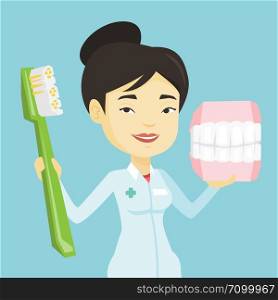 Young asian smiling dentist holding dental jaw model and a toothbrush in hands. Friendly happy dentist showing dental jaw model and toothbrush. Vector flat design illustration. Square layout.. Dentist with dental jaw model and toothbrush.