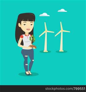 Young asian smiling worker of wind farm. Woman holding in hands green small plant in soil on the background of wind turbines. Concept of green energy. Vector flat design illustration. Square layout.. Woman holding small plant vector illustration.