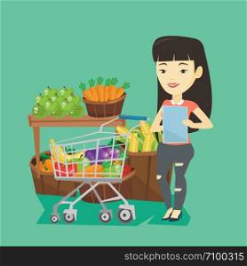 Young asian woman checking shopping list. Smiling woman holding shopping list near trolley with products. Happy woman writing in shopping list. Vector flat design illustration. Square layout.. Woman with shopping list vector illustration.
