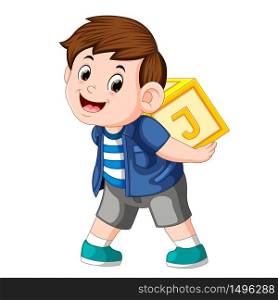 young boy playing alphabet block