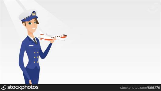 Young caucasian airline pilot holding the model of airplane in hand. Cheerful female airline pilot in uniform. Smiling pilot with the model of airplane. Vector cartoon illustration. Horizontal layout.. Cheerful airline pilot with the model of airplane.
