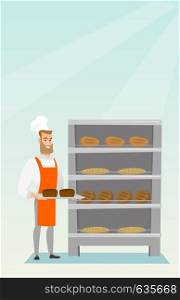 Young caucasian baker holding a tray with bread in a bakery. Confident male baker standing near the bread rack. Smiling baker holding a baking tray. Vector flat design illustration. Vertical layout.. Happy young baker holding a tray with bread.