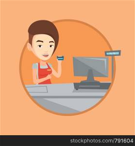 Young caucasian cashier holding credit card at the checkout in supermarket. Happy cashier working at checkout in a supermarket. Vector flat design illustration in the circle isolated on background.. Cashier holding credit card at the checkout.