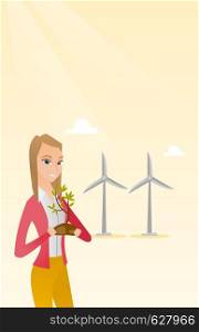 Young caucasian female worker of wind farm. Woman holding in hands green small plant in soil on the background of wind turbines. Green energy concept. Vector flat design illustration. Vertical layout.. Woman holding small plant vector illustration.
