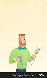 Young caucasian man recharging his smartphone with a mobile phone portable battery. Happy hipster man holding a mobile phone and a battery power bank. Vector cartoon illustration. Vertical layout.. Man reharging smartphone from portable battery.