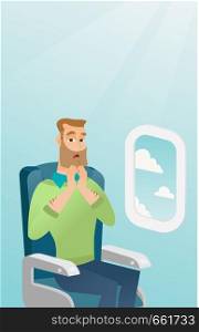 Young caucasian man shocked by plane flight in the turbulent area. Frightened airplane passenger sitting in airplane seat and suffering from aerophobia. Vector cartoon illustration. Vertical layout.. Young caucasian man suffering from aerophobia.
