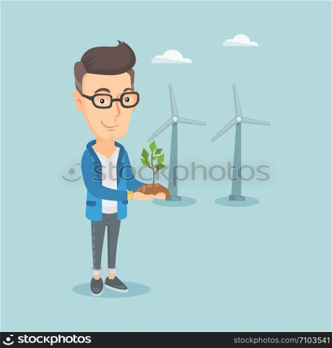 Young caucasian smiling worker of wind farm. Man holding in hands green small plant in soil on the background of wind turbines. Green energy concept. Vector flat design illustration. Square layout.. Man holding small plant vector illustration.