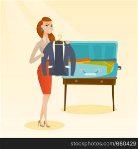 Young caucasian white woman packing her clothes in an opened suitcase. Smiling woman putting a jacket into a suitcase. Cheerful woman preparing for vacation. Vector cartoon illustration. Square layout. Caucasian woman packing clothes in a suitcase.