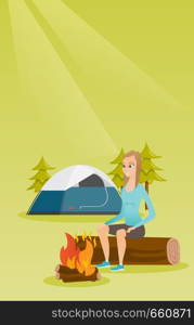 Young caucasian white woman sitting on a log near campfire on the background of camping site. Travelling woman resting near campfire in the campsite. Vector cartoon illustration. Vertical layout.. Woman sitting on log near campfire in the camping.