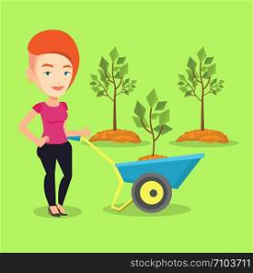 Young gardener pushing wheelbarrow with tree and dirt in the park. Caucasian female gardener with wheelbarrow on a background of newly planted trees. Vector flat design illustration. Square layout.. Woman pushing wheelbarrow with plant.
