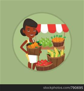 Young greengrocer standing near stall with fruits. Greengrocer standing near market stall. Greengrocer holding basket with fruits. Vector flat design illustration in the circle isolated on background.. Street seller with fruits and vegetables.
