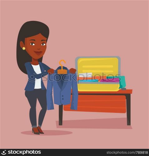 Young happy woman packing clothes in an opened suitcase. Smiling african-american woman putting a jacket into a suitcase. Woman preparing for vacation. Vector flat design illustration. Square layout.. Woman packing her suitcase vector illustration.