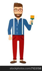 Young hipster painter with beard holding a paint brush vector flat design illustration isolated on white background. Vertical layout.. Painter with paint brush.