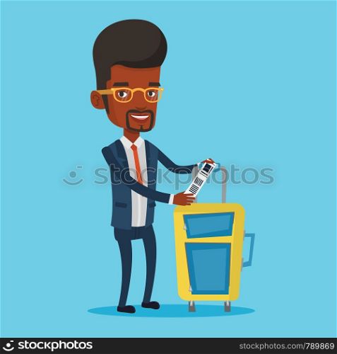 Young man holding travel insurance tag. Business class passenger standing near suitcase with priority luggage tag. Business man showing luggage tag. Vector flat design illustration. Square layout.. African-american business man showing luggage tag.