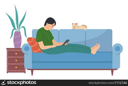 Young man is lying on the couch with a tablet. The guy sits with electronic equipment in his hands. The cat lies on the sofa bed. Male character playing on his tablet flat vector illustration. Young man lying on the couch with a tablet. The guy sits with electronic equipment in his hands