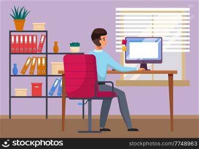 Young man is working at his computer. Modern office interior with work process. Working at home programmer freelancer online sitting on the pink armchair. Happy worker. Employee, co-worker to the team. Young man is working at his computer. Modern office interior with work process, freelancer back view