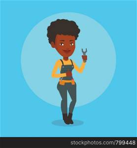 Young smiling repairman standing with a spanner in hand. An african-american repairman giving thumb up. Female repairman in overalls holding a spanner. Vector flat design illustration. Square layout.. Repairman holding spanner vector illustration.