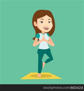Young sportswoman standing in yoga tree pose. Caucasian sportswoman meditating in yoga tree position. Sporty woman doing yoga on the mat. Vector flat design illustration. Square layout.. Young woman practicing yoga tree pose.