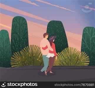 Young woman and man in love, hugging each other, walking outdoor in the evening. Embraces of a loving couple. Romantic concept. Relationships between male and female. Successful people in love on date. Young woman and man in love, hugging each other, walking outdoor. Embraces of a loving couple