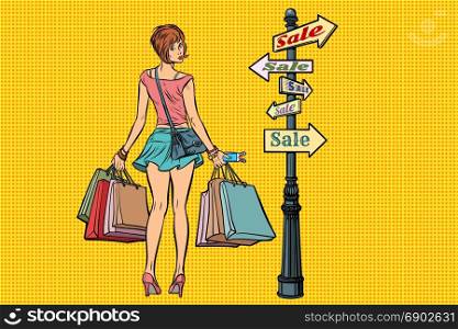 young woman at the sign for sales. Pop art retro vector illustration. young woman at the sign for sales