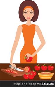 Young woman cuts tomatoes
