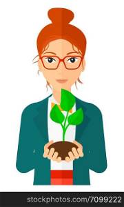 Young woman holding in hands a small plant in soil vector flat design illustration isolated on white background. Vertical layout.. Woman holding plant.
