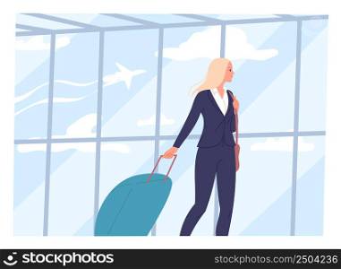 Young woman walks through an airport with a suitcase.. Young woman walks through an airport with a suitcase