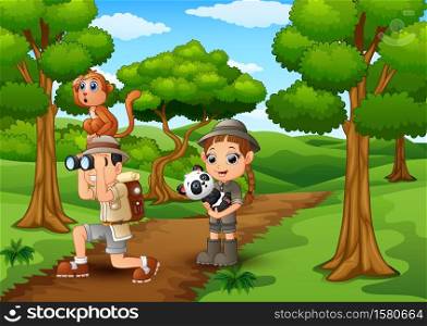 Zookeeper boy and girl with animals in the jungle